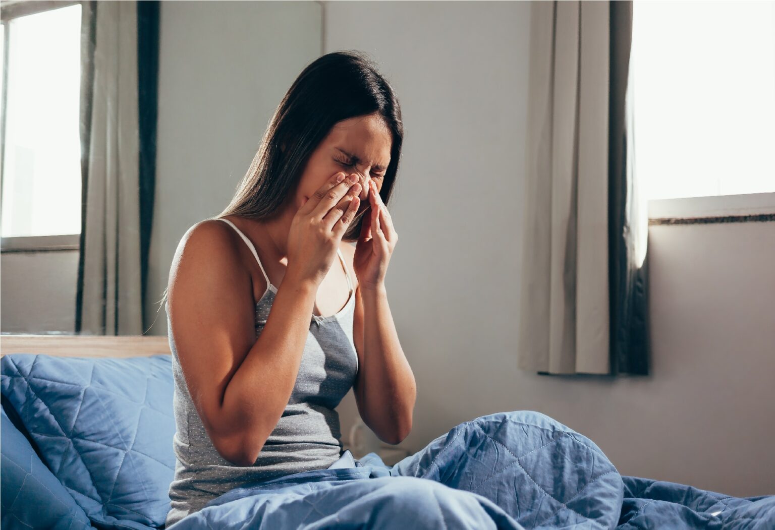 Sinus pain, sinus pressure, sinusitis. Sad woman holding